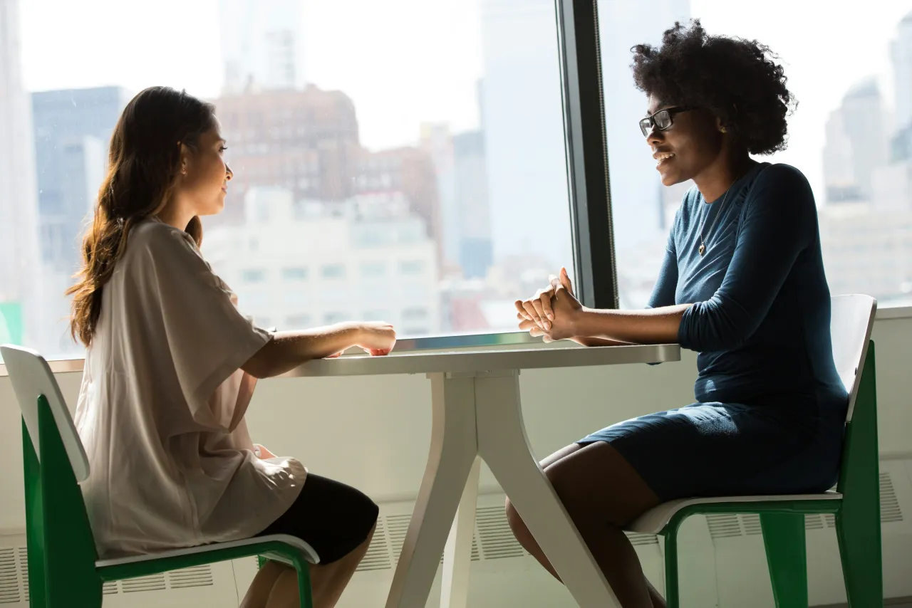 A one-on-one meeting between a recruiter and a candidate